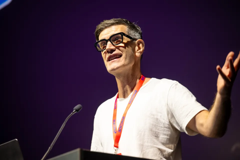 Speaker presenting on stage at NodeFest
